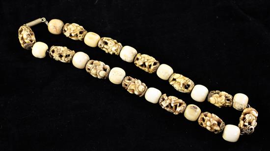 A Japanese ivory and bone Ojime bead necklace, late 19th century,